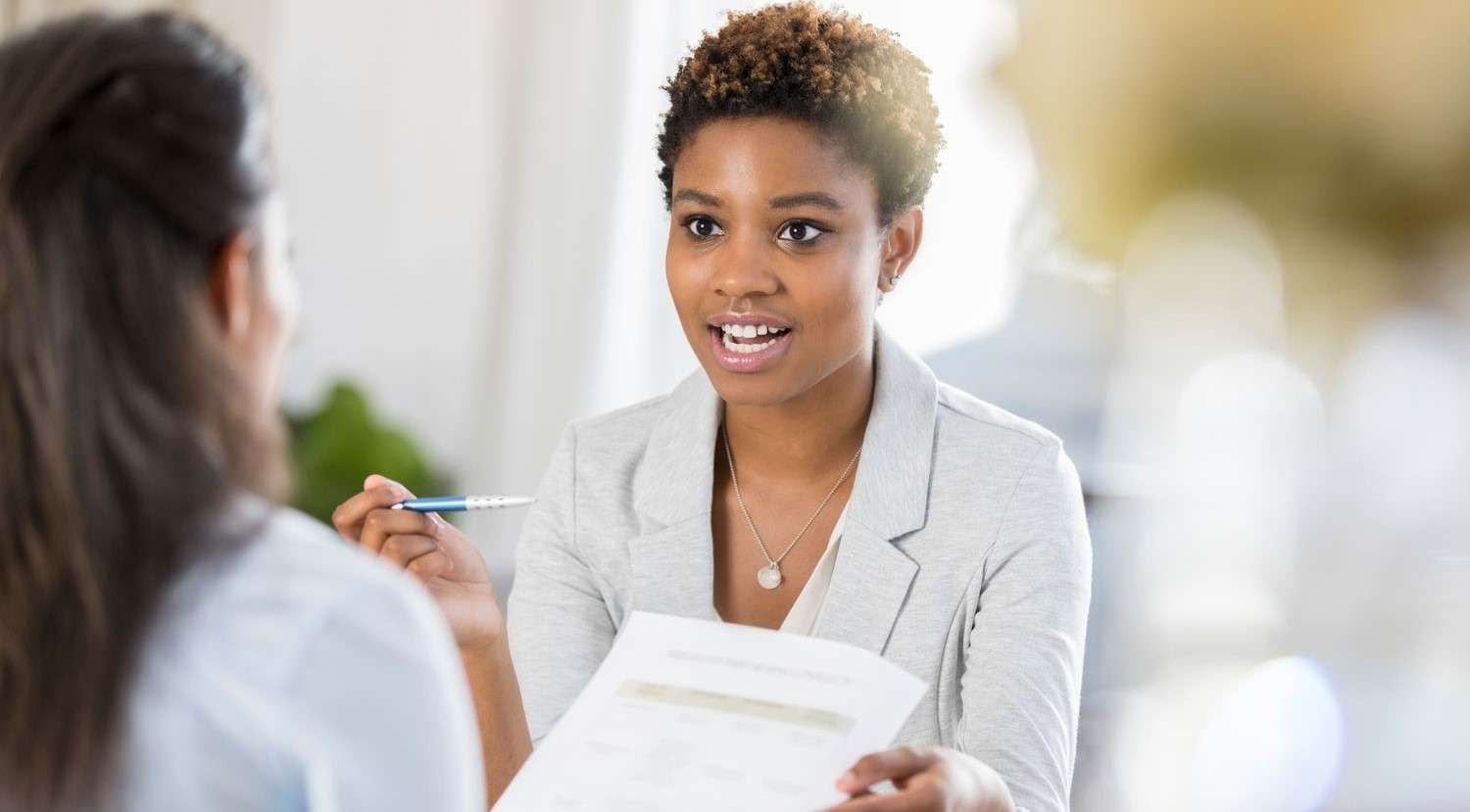 businesswomen-meet-to-discuss-document-865900230-b8ae8a2ec9ce41e59968416427e8969e