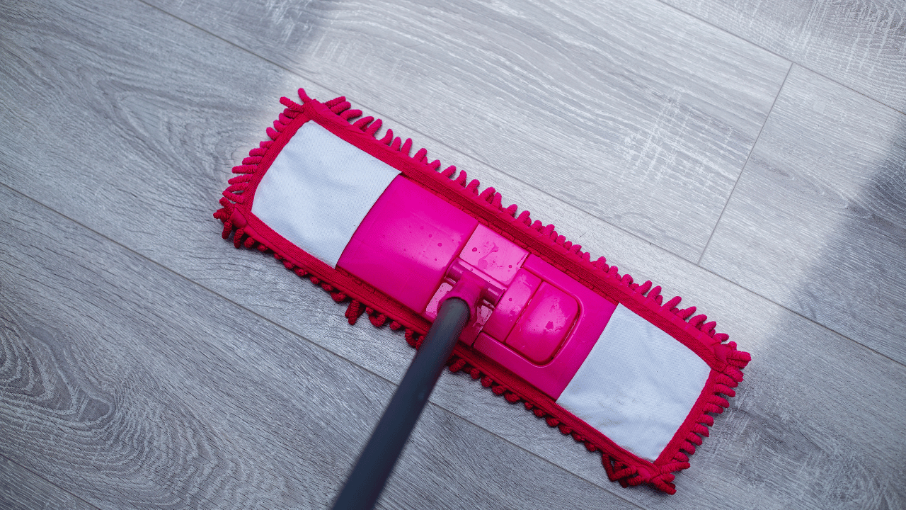 A woman sweeping the floor