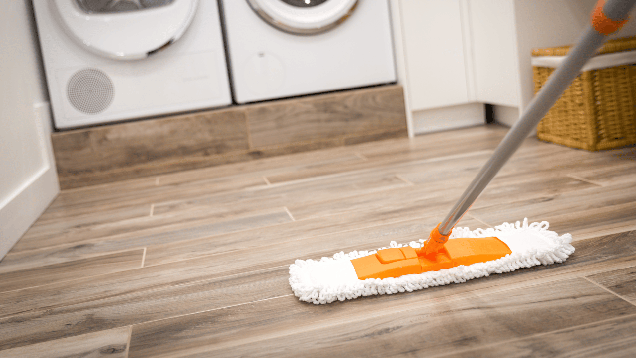 A woman sweeping the floor