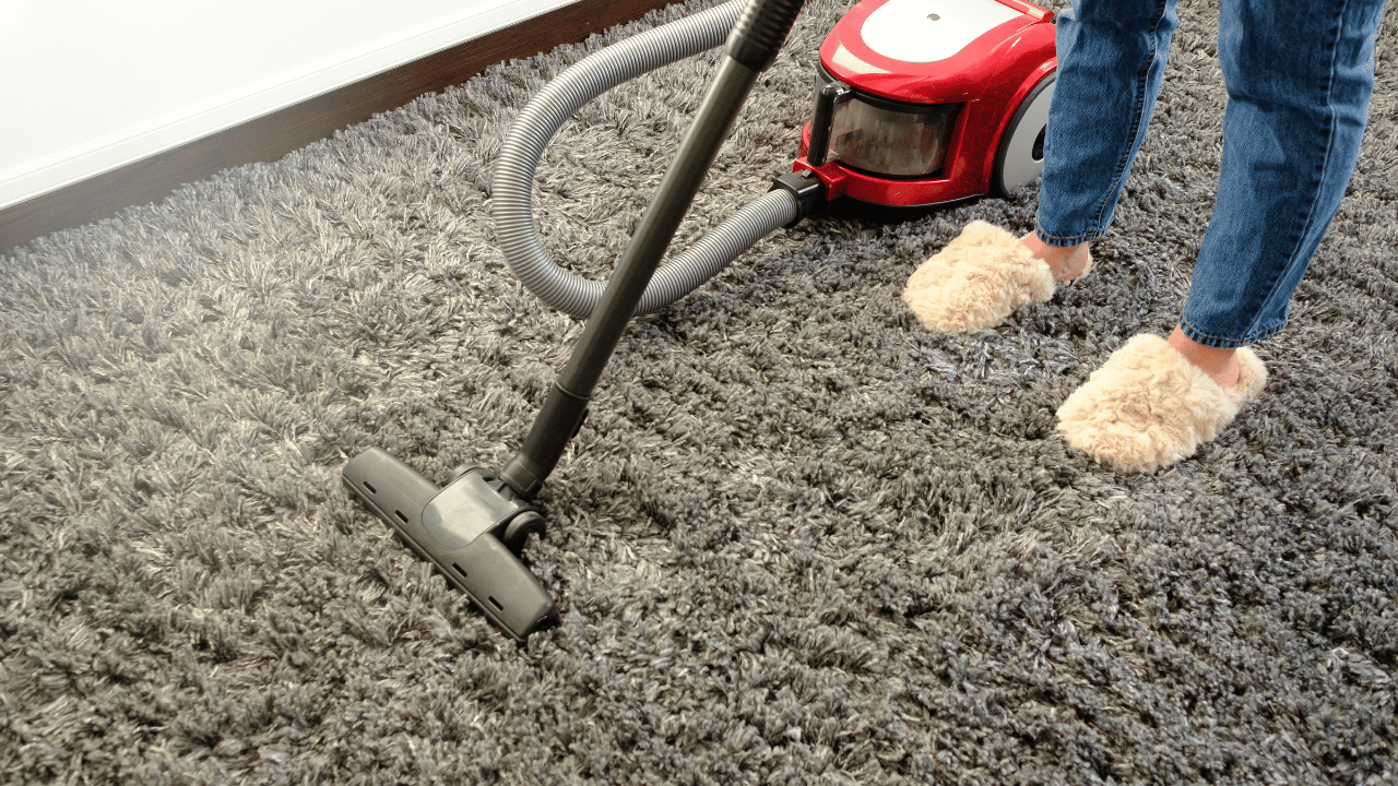 A woman sweeping the floor