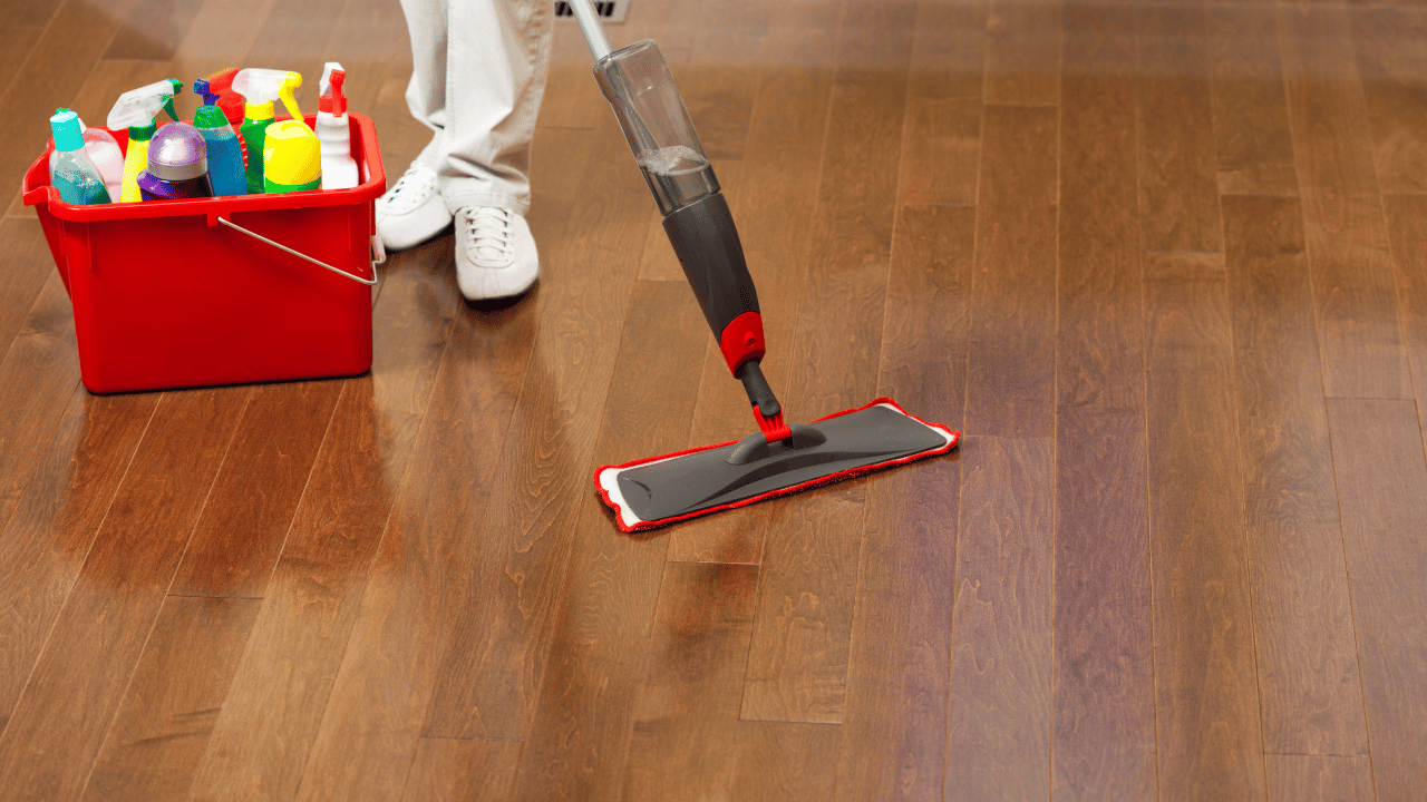 A woman sweeping the floor