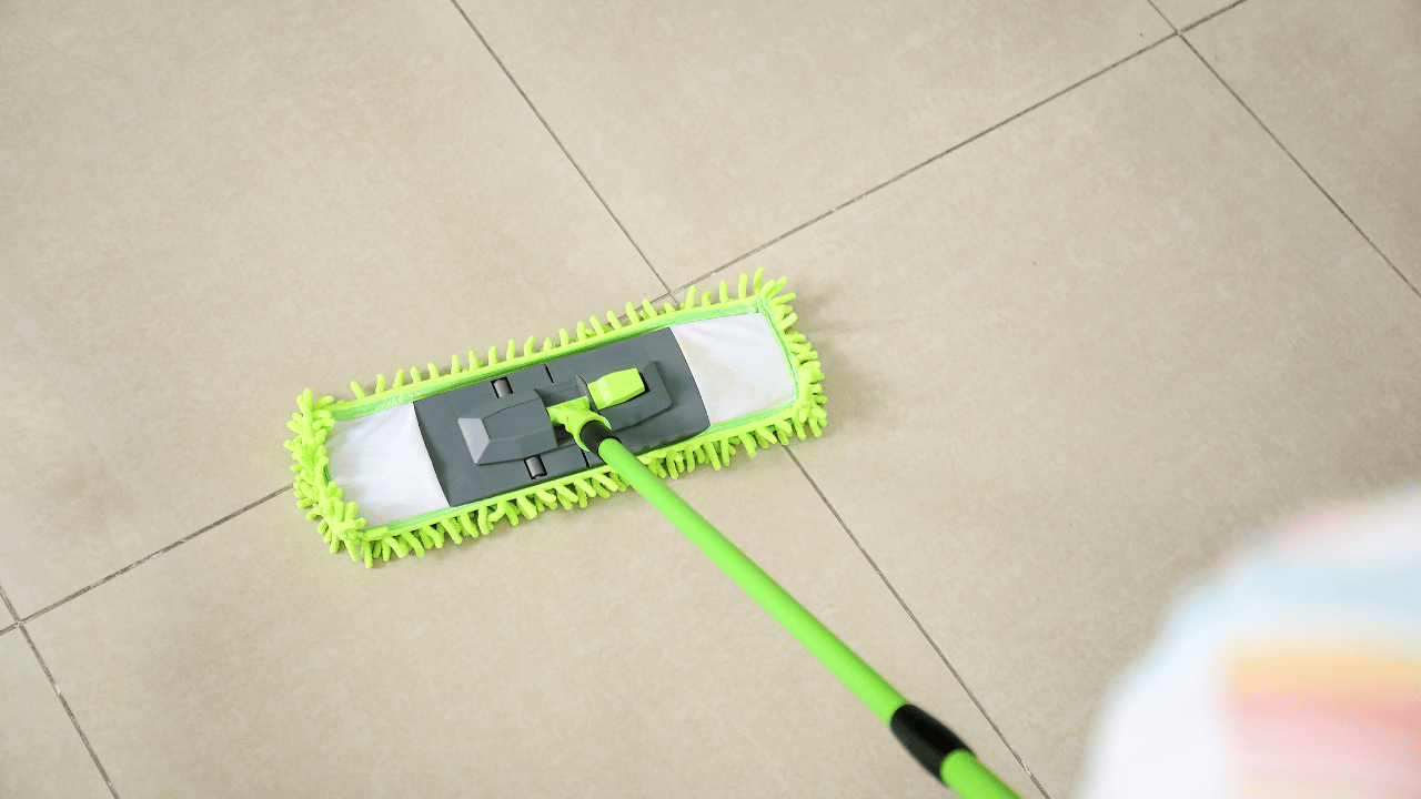 A woman sweeping the floor