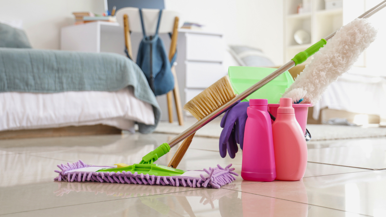 A woman sweeping the floor