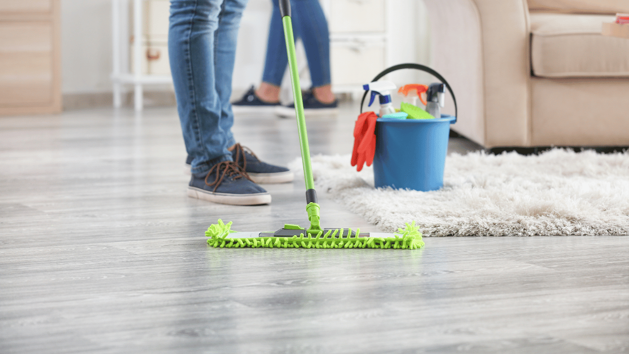 A woman sweeping the floor